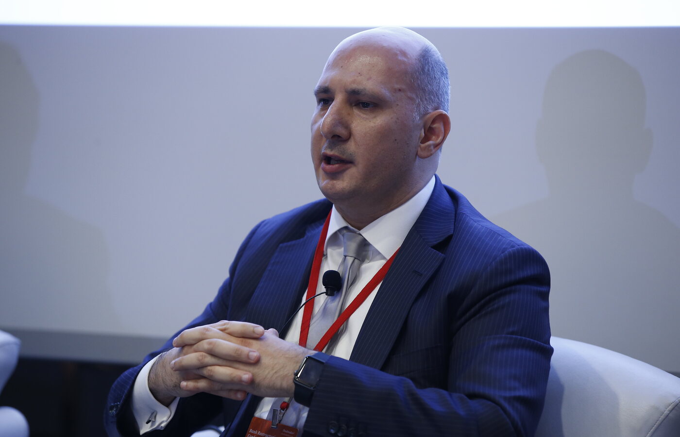 Alper Eker speaking at a professional risk-management event